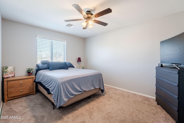 bedroom with ceiling fan and light colored carpet