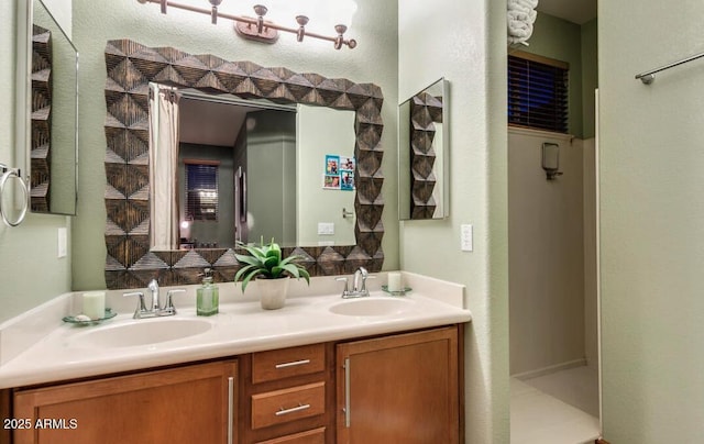 bathroom with vanity and walk in shower