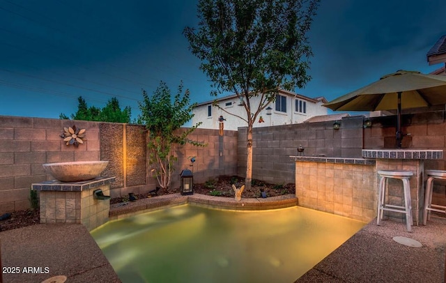 view of patio featuring exterior bar