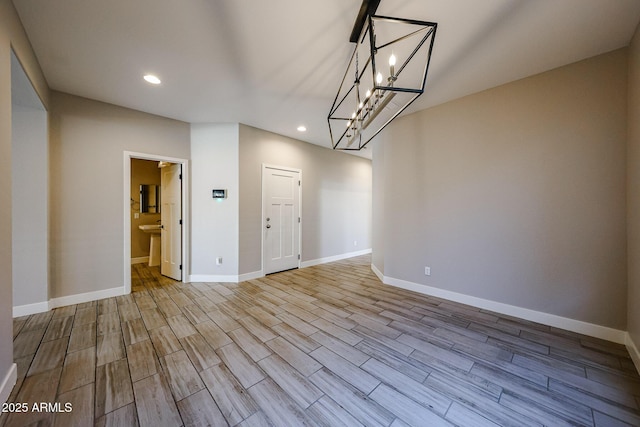 10036 E Naranja Ave, Mesa, AZ 85209 - unfurnished room with recessed lighting, wood finished floors, and a chandelier