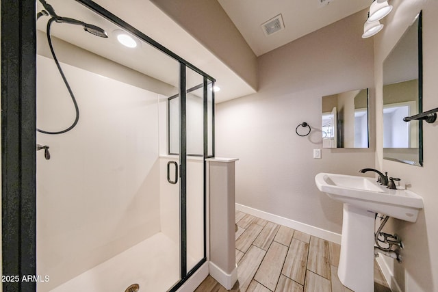 10036 E Naranja Ave, Mesa, AZ 85209 - bathroom featuring a shower stall and wood finished floors
