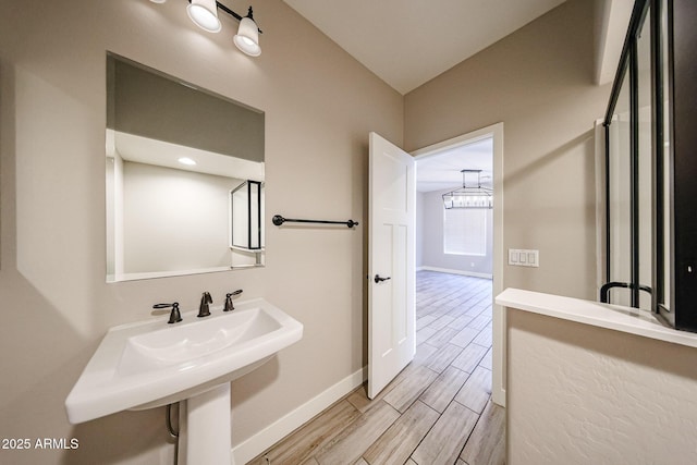 10036 E Naranja Ave, Mesa, AZ 85209 - bathroom featuring wood finish floors and a chandelier