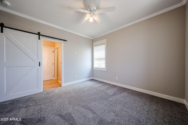 10036 E Naranja Ave, Mesa, AZ 85209 - carpeted spare room featuring a smoke detector, ceiling fan, ornamental molding, and a barn door