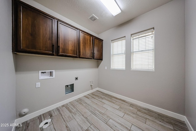10036 E Naranja Ave, Mesa, AZ 85209 - washroom with hookup for an electric dryer, cabinet space, gas dryer hookup, washer hookup, and a textured ceiling