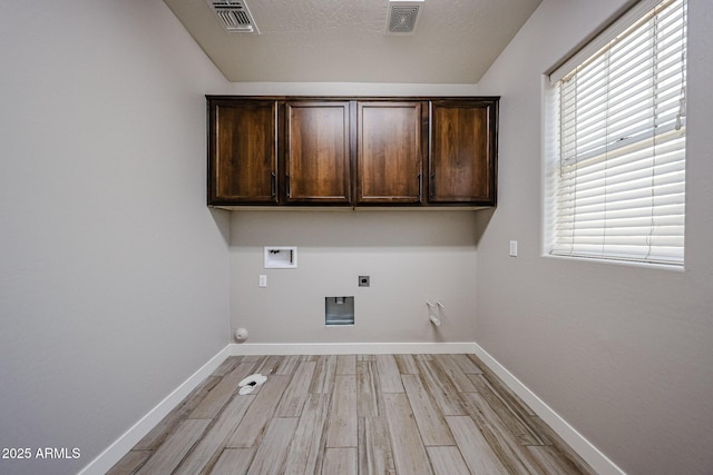 10036 E Naranja Ave, Mesa, AZ 85209 - laundry room with hookup for a gas dryer, hookup for a washing machine, cabinet space, hookup for an electric dryer, and light wood-type flooring