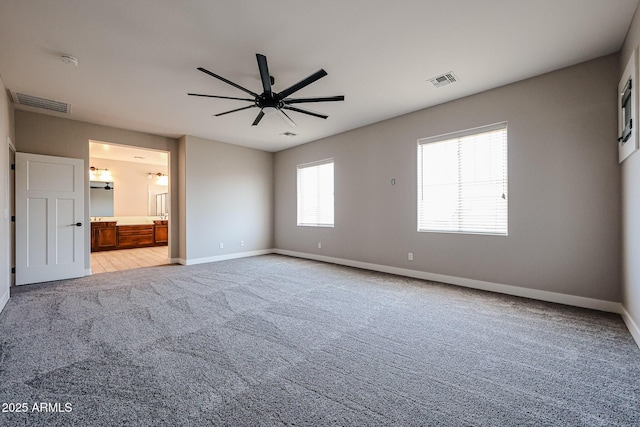 10036 E Naranja Ave, Mesa, AZ 85209 - unfurnished bedroom with carpet, connected bathroom, and a ceiling fan