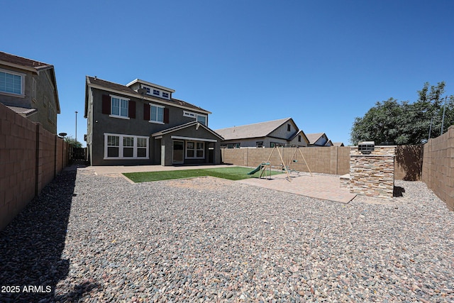 10036 E Naranja Ave, Mesa, AZ 85209 - back of house with a playground, a patio, stucco siding, and a fenced backyard