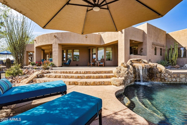 view of patio / terrace with an outdoor pool