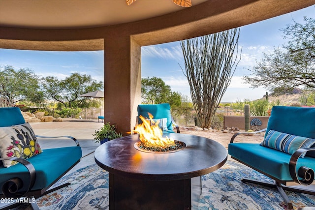 view of patio / terrace featuring an outdoor fire pit and a fenced backyard