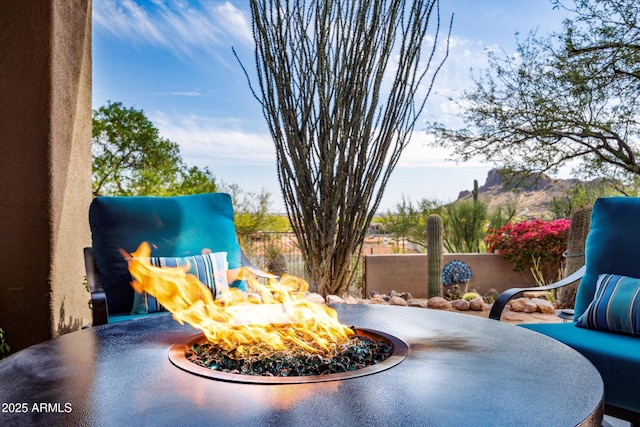 exterior view of an outdoor fire pit and fence