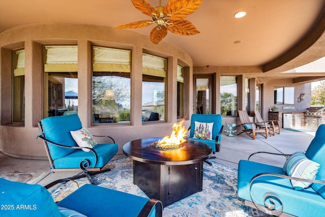 view of patio / terrace featuring an outdoor fire pit, a ceiling fan, and a grill
