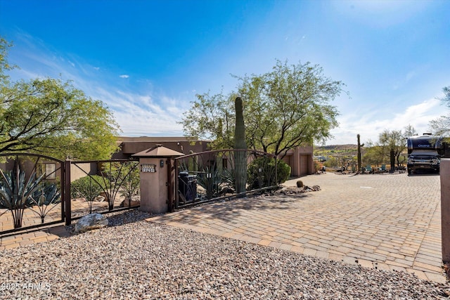 view of front of house with a gate