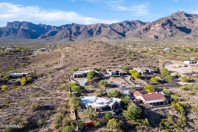 aerial view of property and surrounding area featuring mountains