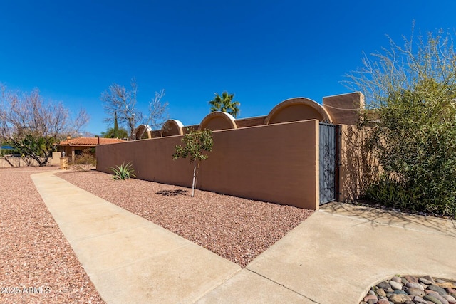 exterior space featuring a gate and fence