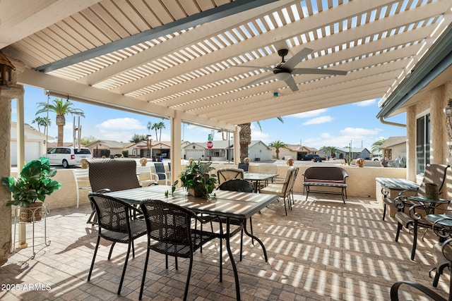 view of patio featuring outdoor dining space, a residential view, and a pergola