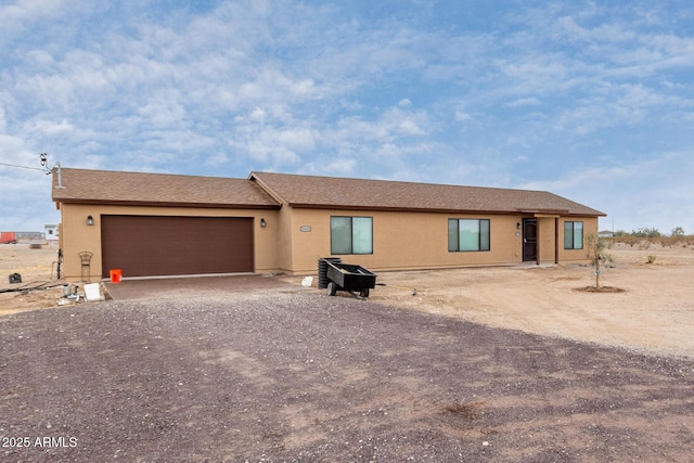 single story home featuring a garage