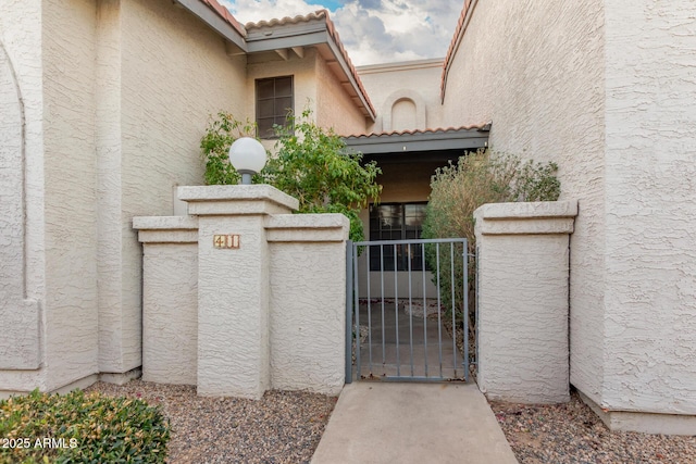 view of gate with fence