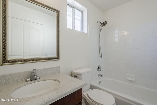 bathroom featuring vanity, toilet, and tub / shower combination