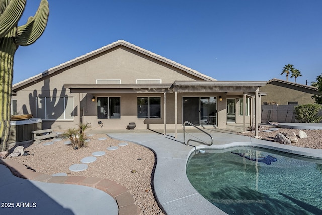 back of house featuring stucco siding, central air condition unit, a patio, and fence