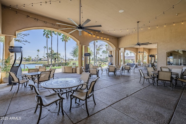 view of patio featuring outdoor dining area and ceiling fan