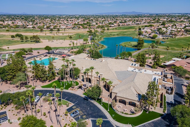 birds eye view of property featuring a residential view, a water view, and view of golf course