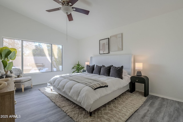 bedroom with vaulted ceiling, ceiling fan, and wood finished floors