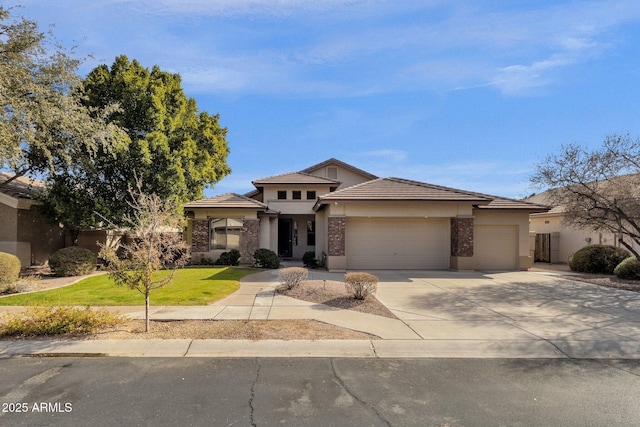 prairie-style house with a garage and a front lawn