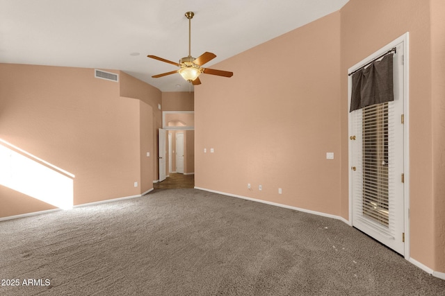 interior space with ceiling fan, vaulted ceiling, and carpet