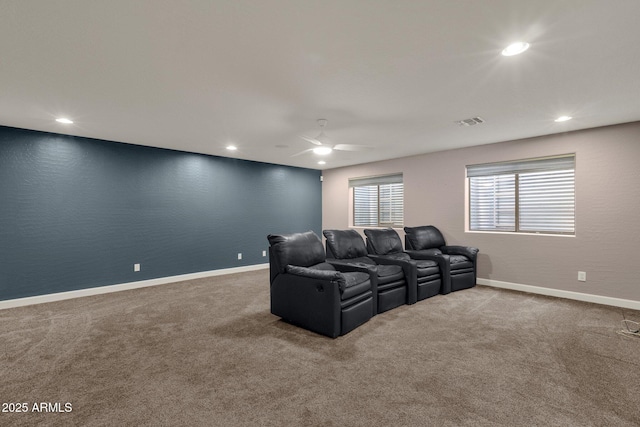 carpeted cinema with ceiling fan