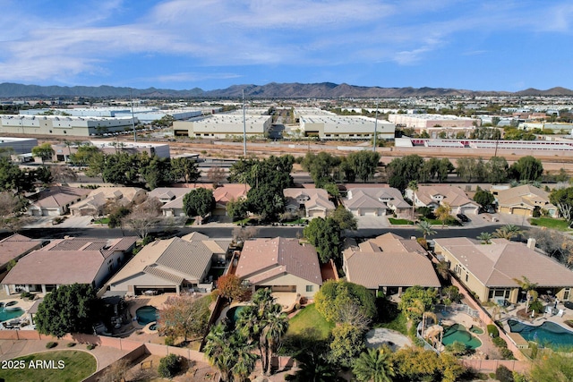 birds eye view of property featuring a mountain view