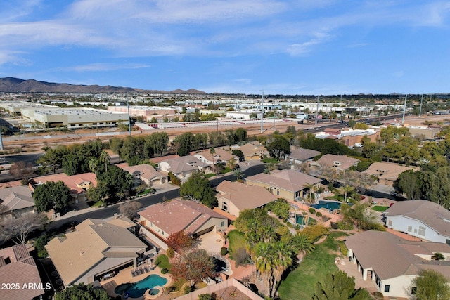 birds eye view of property featuring a mountain view