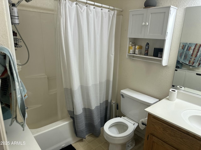 full bath featuring toilet, a textured wall, vanity, and shower / bathtub combination with curtain