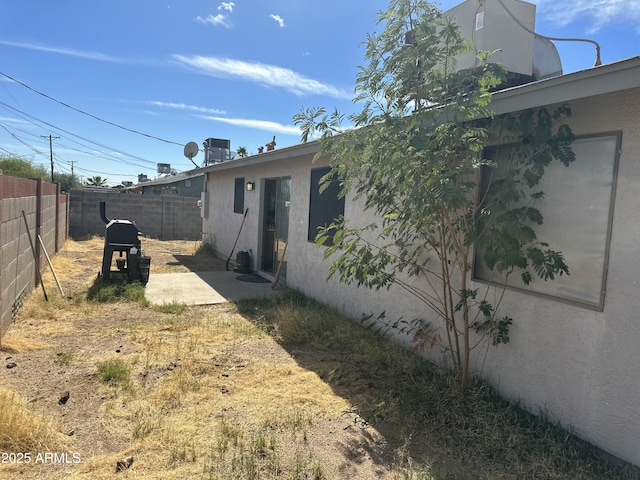 view of yard featuring a patio area and a fenced backyard