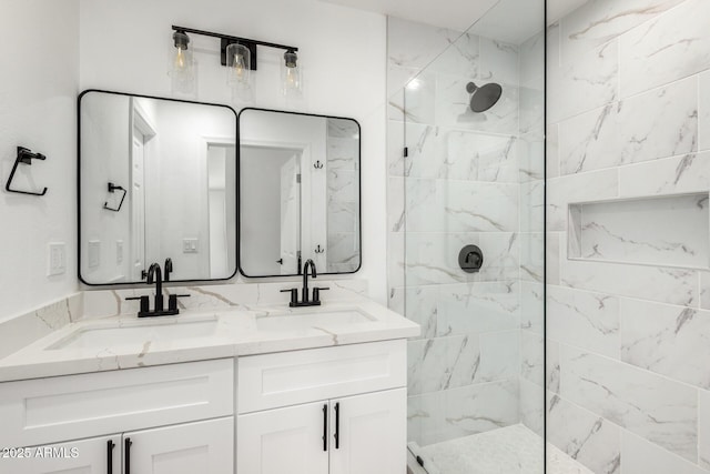 bathroom with walk in shower and a sink