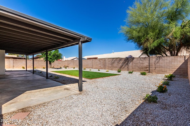 view of yard featuring a fenced backyard and a patio area