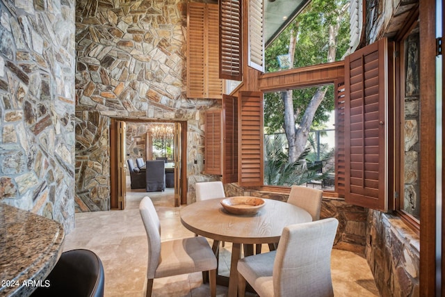 dining area featuring a high ceiling