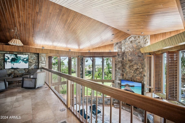 hall featuring wood ceiling and lofted ceiling