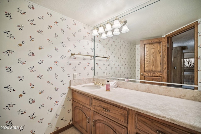 bathroom featuring vanity and a textured ceiling