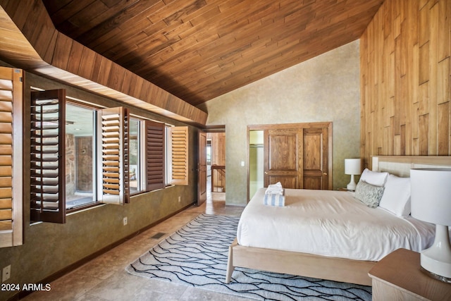 bedroom featuring high vaulted ceiling and wooden ceiling