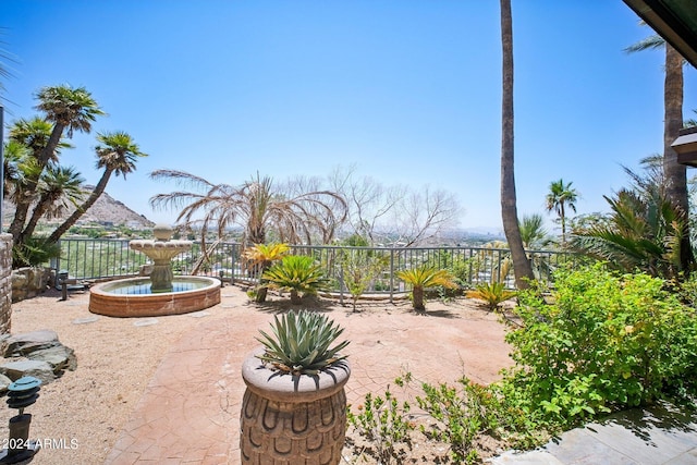 view of patio / terrace featuring a mountain view