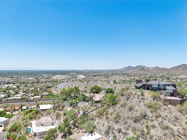 birds eye view of property with a mountain view