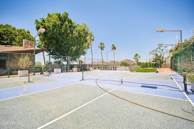 view of basketball court with tennis court