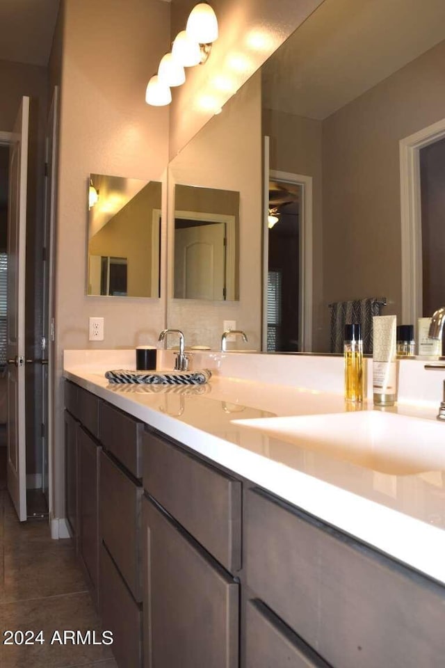 bathroom with vanity and tile patterned flooring