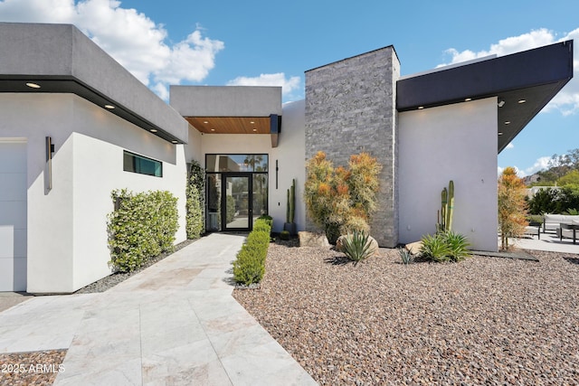 doorway to property with stucco siding