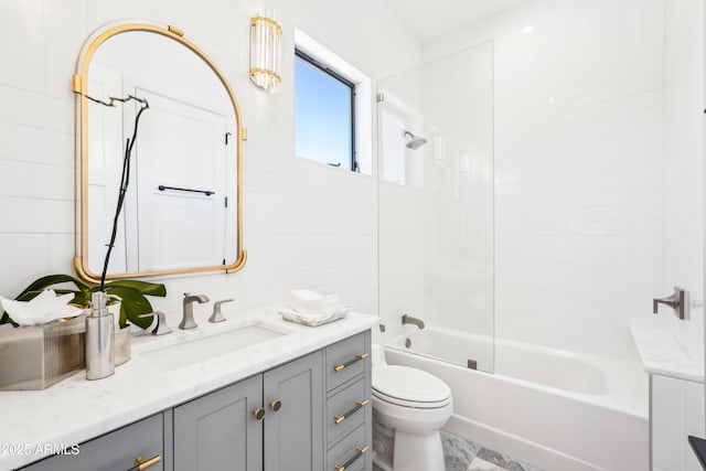 full bathroom with vanity, washtub / shower combination, and toilet