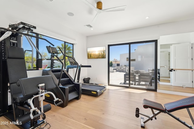 exercise room featuring ceiling fan, recessed lighting, wood finished floors, and visible vents