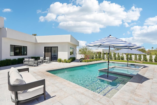 view of pool with an outdoor hangout area, a pool with connected hot tub, and a patio area