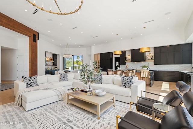 living area with recessed lighting and light wood-type flooring