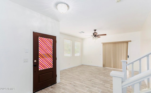 entryway with light hardwood / wood-style flooring and ceiling fan