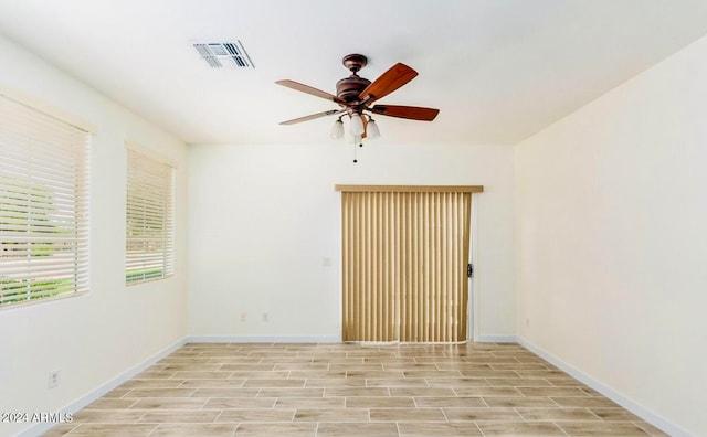 empty room featuring ceiling fan and light wood-type flooring